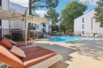 Sparkling swimming pool with sundeck